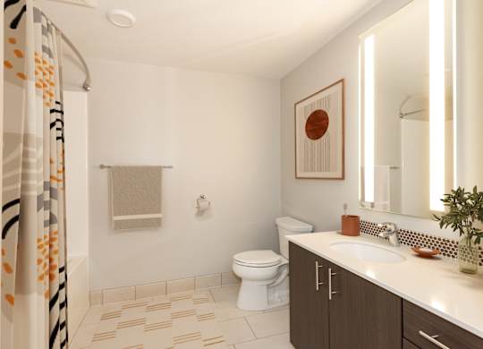 A bathroom with a toilet, sink, and shower.