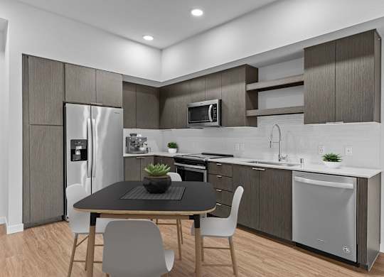 A modern kitchen with a table and chairs.