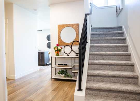 A staircase with a metal railing and steps
