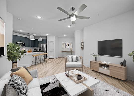 a living room with a ceiling fan and a television