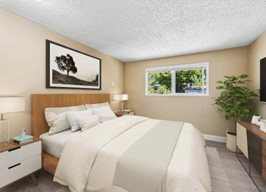A bedroom with a large bed, a nightstand, a lamp, a plant, and a framed picture of a tree on the wall.