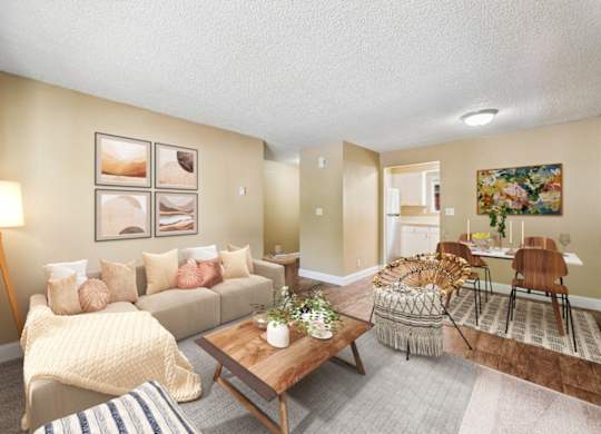 A living room with a couch, a coffee table, and a lamp.