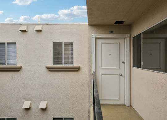 A white door is on the right side of the image.