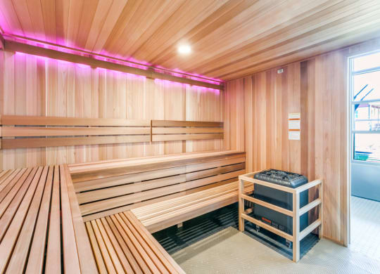 a wooden sauna with benches and a table