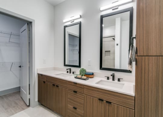 the preserve at ballantyne commons modern bathroom with two sinks and two mirrors