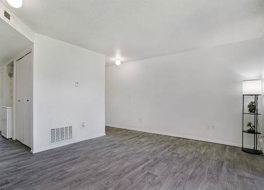 A room with a grey floor and white walls.