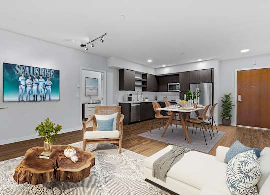 A modern living room with a wooden coffee table and a painting of a group of people.