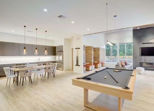 a pool table in the center of a living room