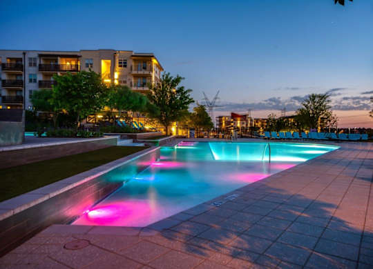 A long rectangular pool with lights underneath it.