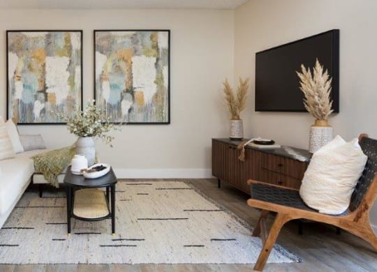 a living room with a white couch and a table