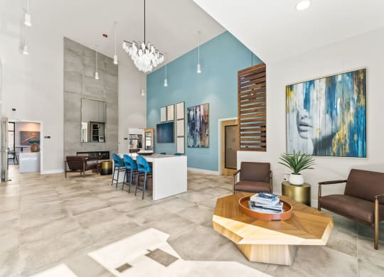 a living room with blue walls and a table and chairs