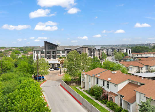 A view of a residential area with houses and a road.
