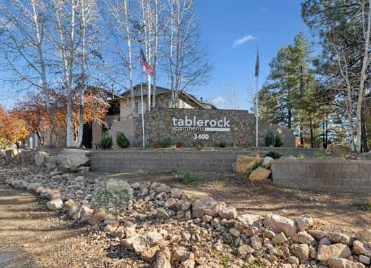 A sign for Taberock Apartment reads 3400.