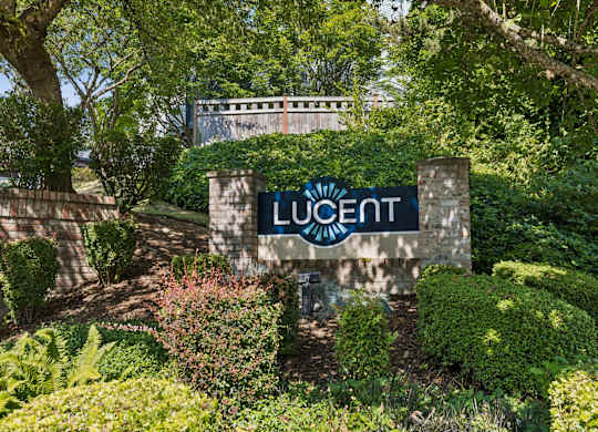 A sign that says Lucent in front of a building.