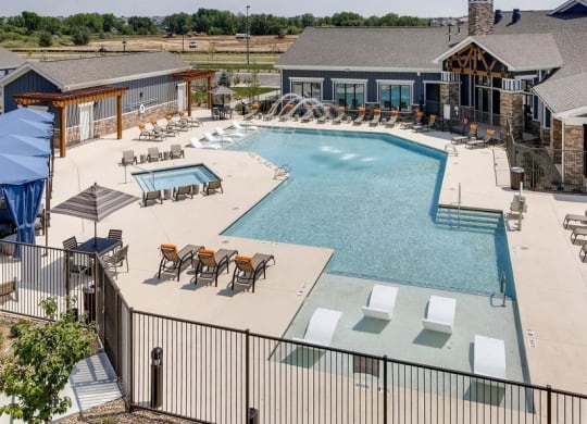 The Ranch at First Creek Apartments Swimming Pool Area with Lounging Area