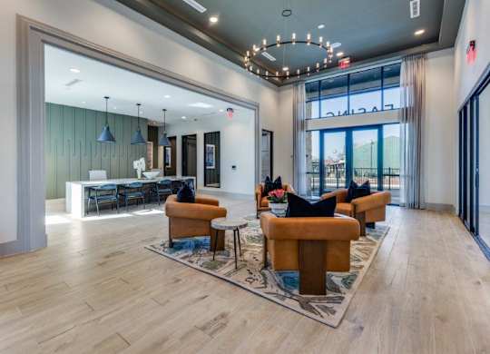 A spacious living room with a wooden floor and a large window.