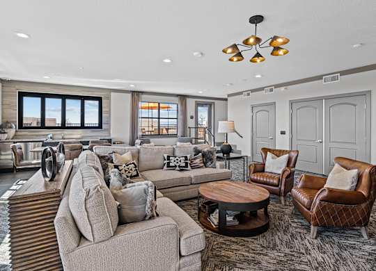 a living room with couches and chairs and a kitchen at Alton Jefferson Park, Colorado