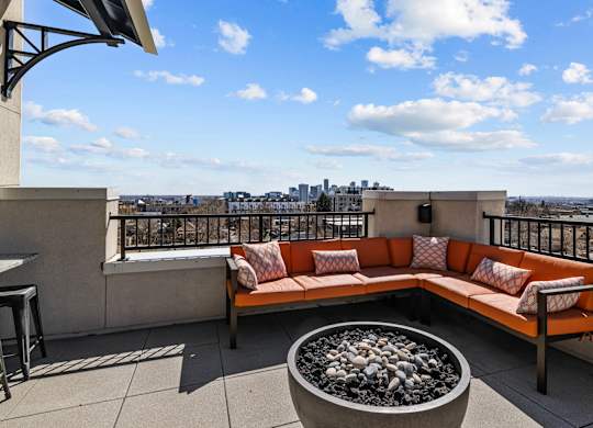 a rooftop patio with a couch and a fire pit at Alton Jefferson Park, Colorado, 80211