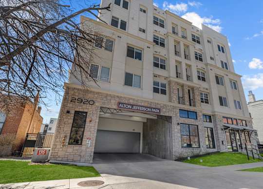 an apartment building with a large garage door in front of it at Alton Jefferson Park, Denver