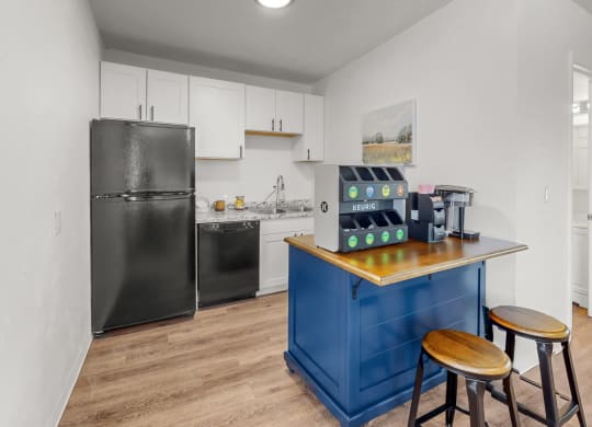 a kitchen with a counter top and a refrigerator