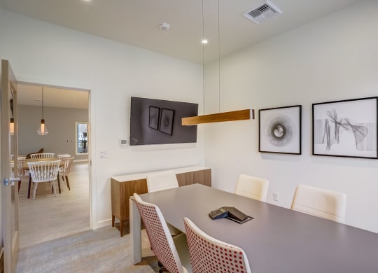 a dining room with a table and chairs