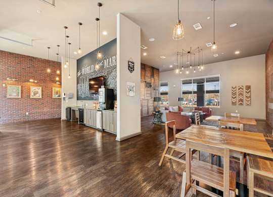 A restaurant with wooden floors and tables.
