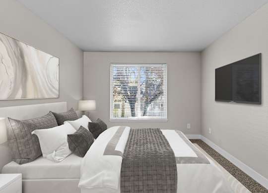 an image of a bedroom with a bed and a window
