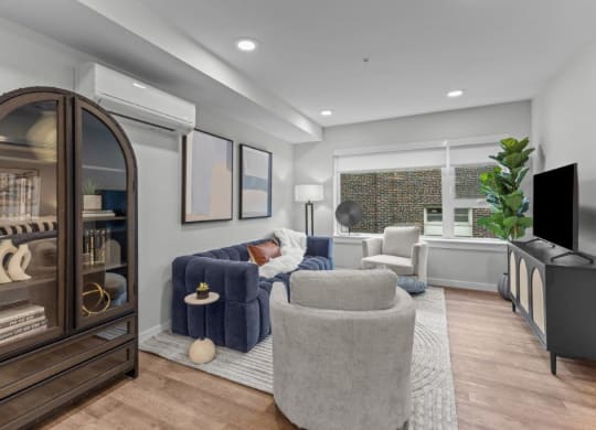 a living room with a couch and a tv