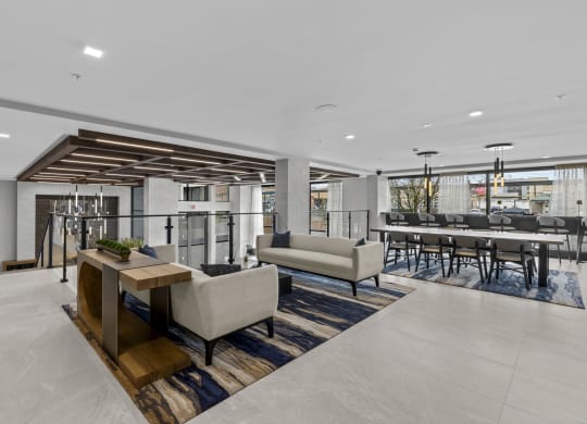 a living room with couches and chairs and a bar with tables and chairs