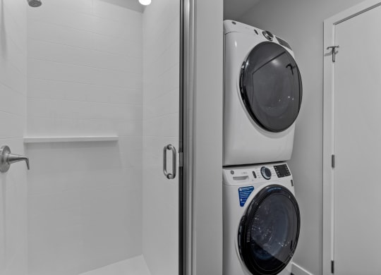 Gridline Apartments Bathroom with Stacked Washer and Dryer