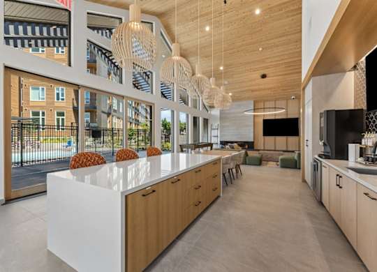A modern kitchen with wooden cabinets and a white countertop.