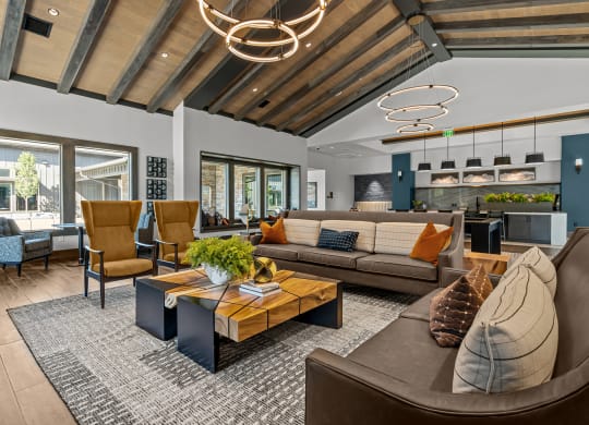 a living room with couches and chairs and a table