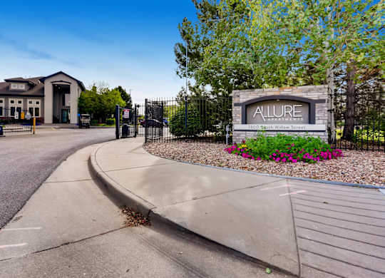 The image shows a gated entrance to a facility named Allure.