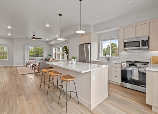 Alpine Landing Townhomes in Garden City, Idaho Model Kitchen with Large Island and Living Room