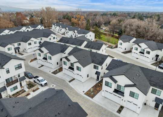 A bird's eye view of a residential area with multiple houses.