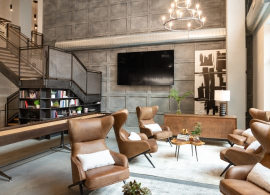 a living room filled with furniture and a flat screen tv