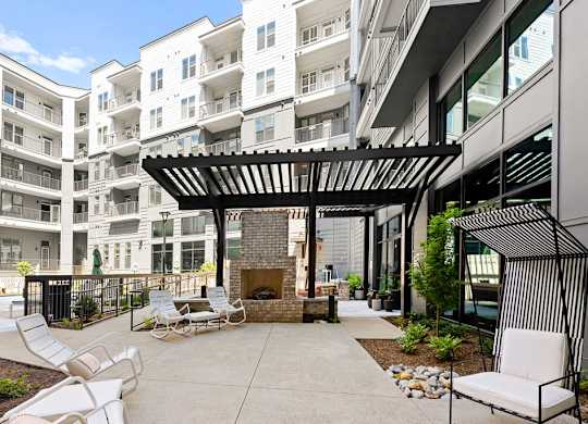 Alton Mill District Apartments in Charlotte, North Carolina Poolside Patio with Fireplace