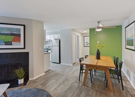 Alvista 23 Apartment Homes Model Living Room with Fireplace and Dining Area