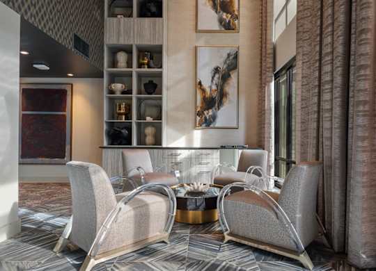 A modern living room with a grey sofa and a coffee table.
