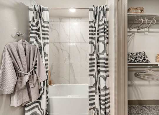A shower with large closet next  to it