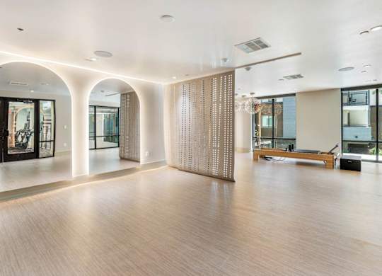 A fitness studio with open space and mirrors