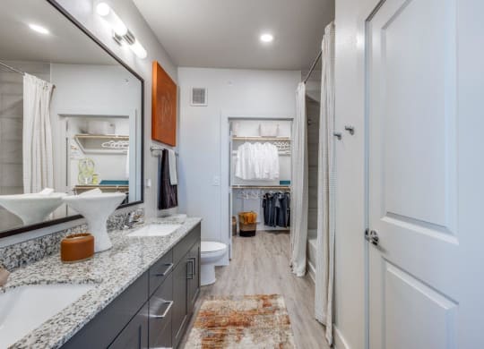 Aura Beacon Island Model Bathroom with Walk-In Closet