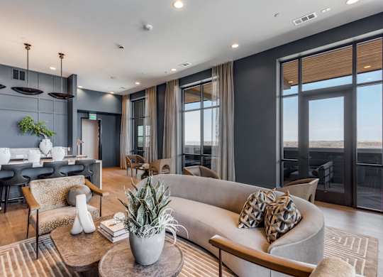 A modern living room with a grey sofa and a wooden coffee table.