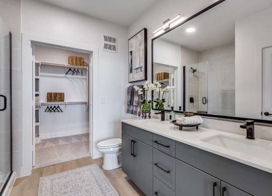 A bathroom with a white toilet and a white sink.