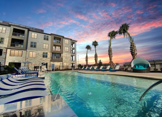 Cromwell at Plum Creek Apartments Pool Area and Lounge Chairs