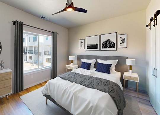 A bedroom with a large bed, a dresser, and a ceiling fan.