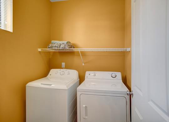 A laundry room with a washer and dryer.
