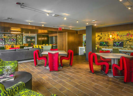 A room with a wooden floor and a mural on the wall.