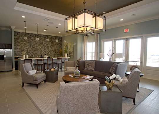 A living room with a grey couch and a coffee table.