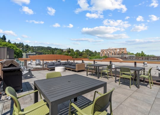 Rooftop deck with grill and picnic area at Collins Circle apartments in the Goose Hollow district in Portland, Oregon.